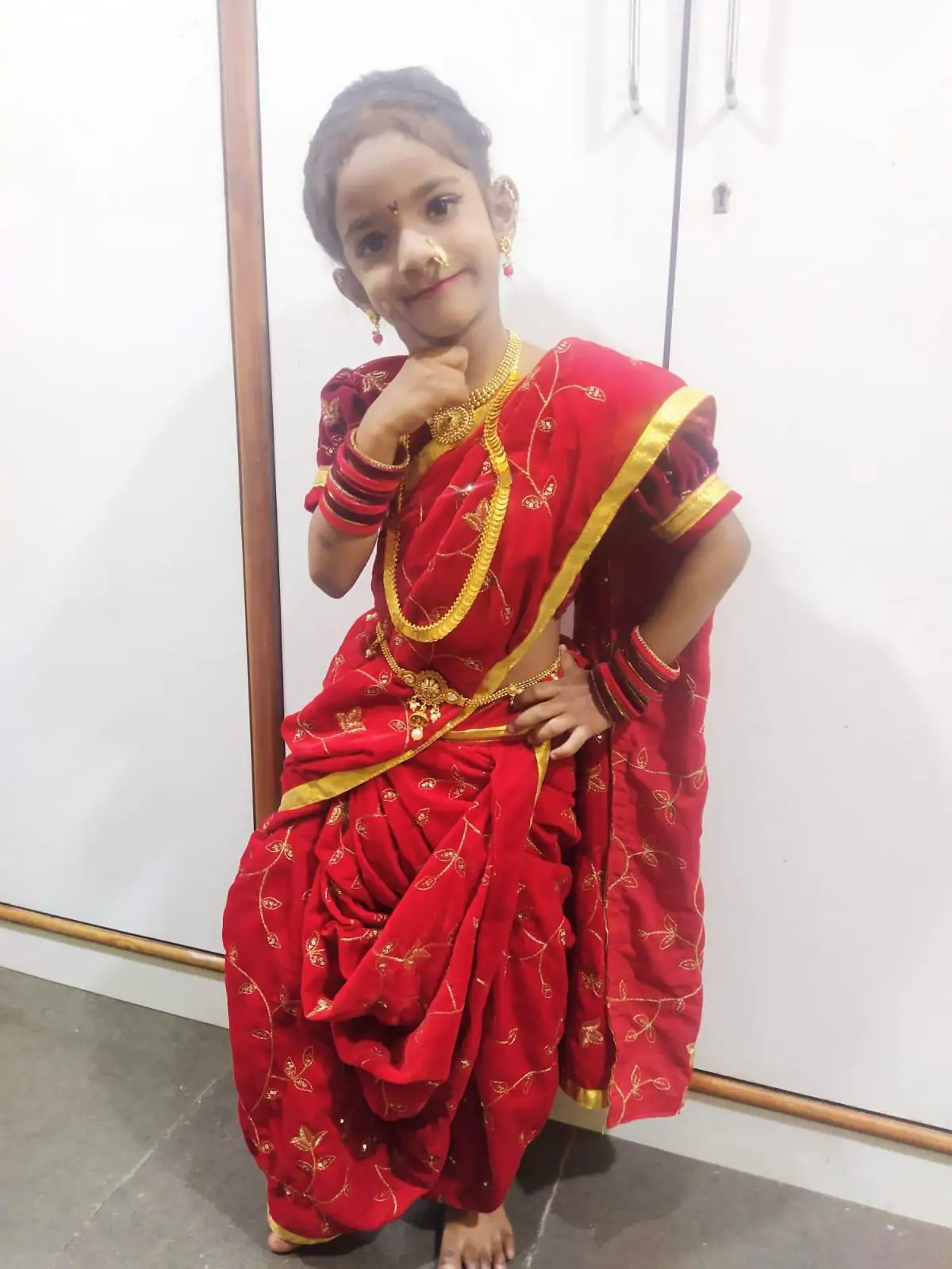 girl seeting in red saree